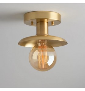 Minimalist semi-recessed brass lighting fixture