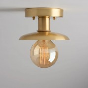 Minimalist semi-recessed brass lighting fixture