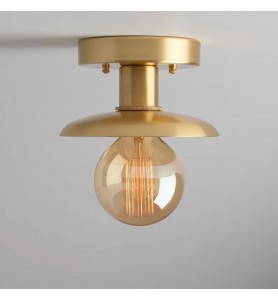 Minimalist semi-recessed brass lighting fixture
